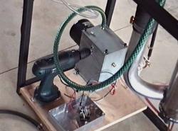 Drill-powered oil pump